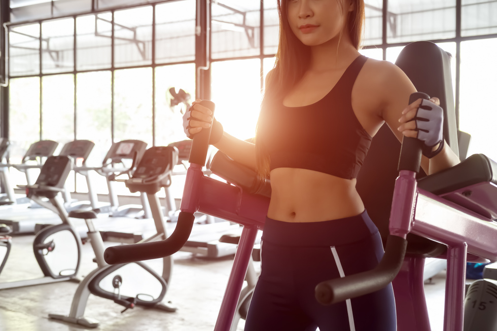 Beautiful Women Working Out at Gym. Concept of Healthy Lifestyle